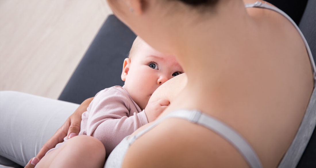 Mom responds to backlash after photo breastfeeding toddler