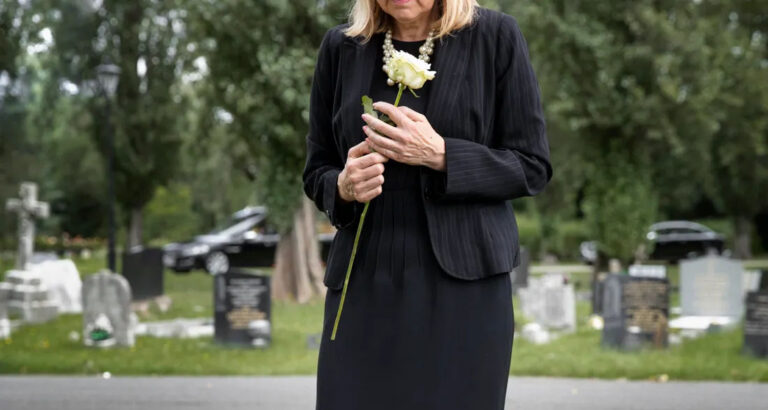 At My Husband’s Funeral, I Opened His Casket to Place a Flower — and Found a Crumpled Note Tucked Under His Hands